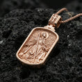 Load image into Gallery viewer, Rose gold plated Saint Roch religious dogtag pendant on volcanic rock, premium macro product photo, sharp relief and clean rectangular silhouette
