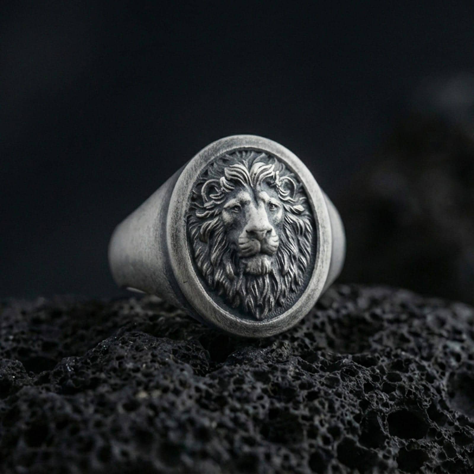 925 sterling silver lion head signet ring on volcanic stone, oxidized finish with deep relief mane details