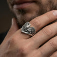 Load image into Gallery viewer, 925 sterling silver eagle ring worn on a finger, oxidized finish showing deep contrast in the feather pattern and wing edges
