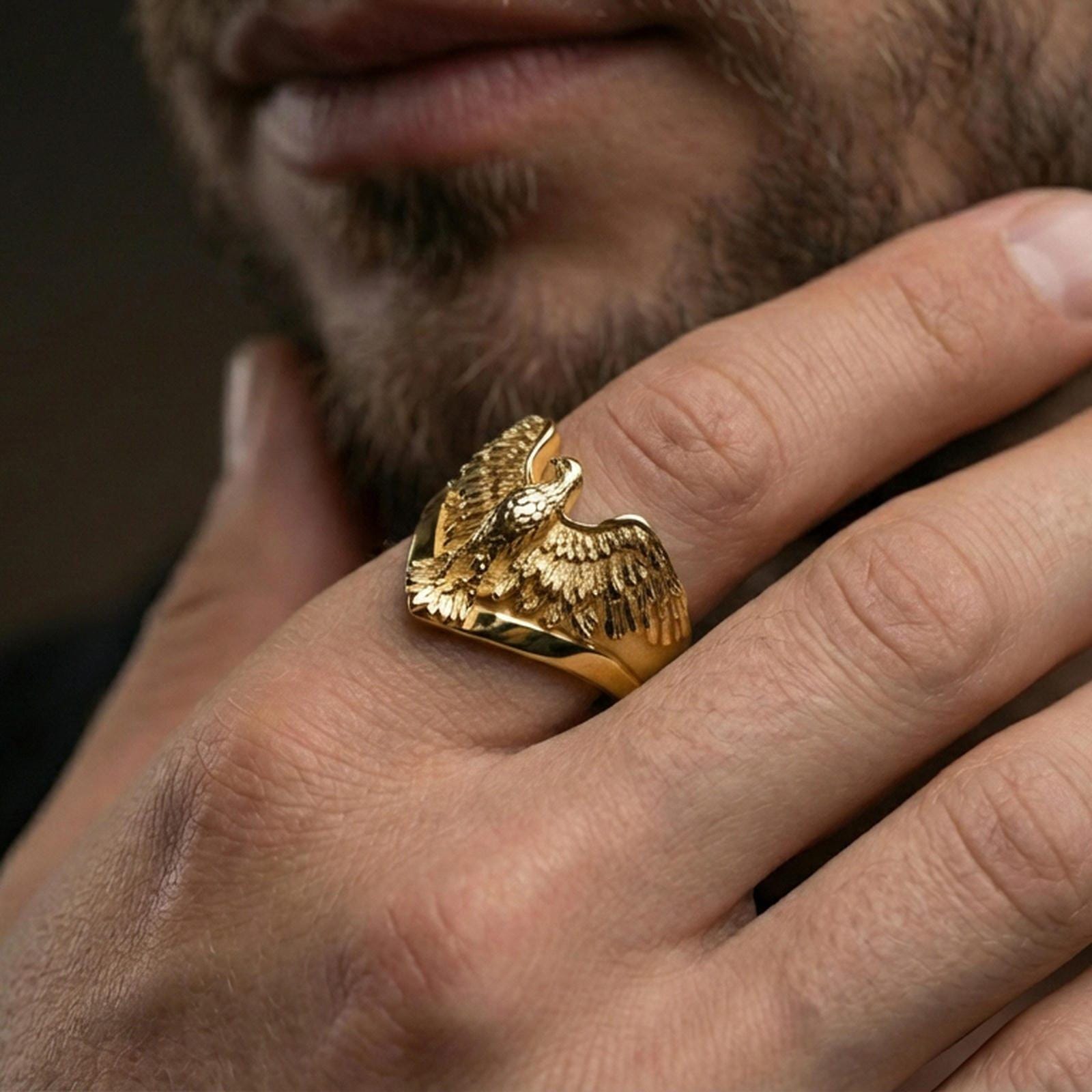 925 sterling silver eagle ring worn on a finger, gold plated finish with premium shine and clear feather layering