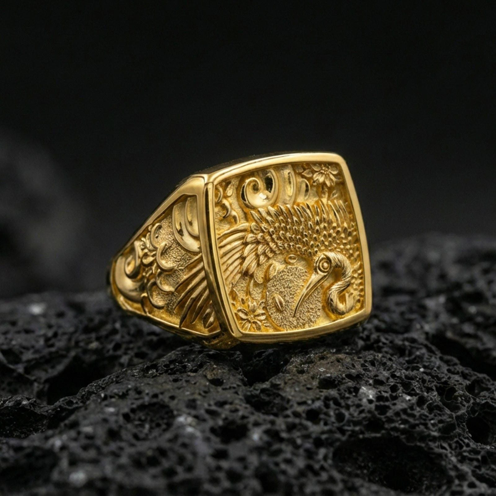 925 sterling silver crane signet ring on volcanic stone, gold plated finish emphasizing the crane motif, floral carving, and ornamental scrollwork
