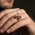 Load image into Gallery viewer, Rose gold plated bull ring on finger, close-up lifestyle photo showcasing the sculpted bull face, horns, and nose ring detail
