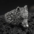 Load image into Gallery viewer, Oxidized sterling silver wolf head ring on volcanic rock, detailed fur texture macro closeup
