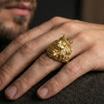 Load image into Gallery viewer, Gold plated crowned lion ring worn on finger, lifestyle wear shot emphasizing the royal lion head, crown details, and strong masculine look
