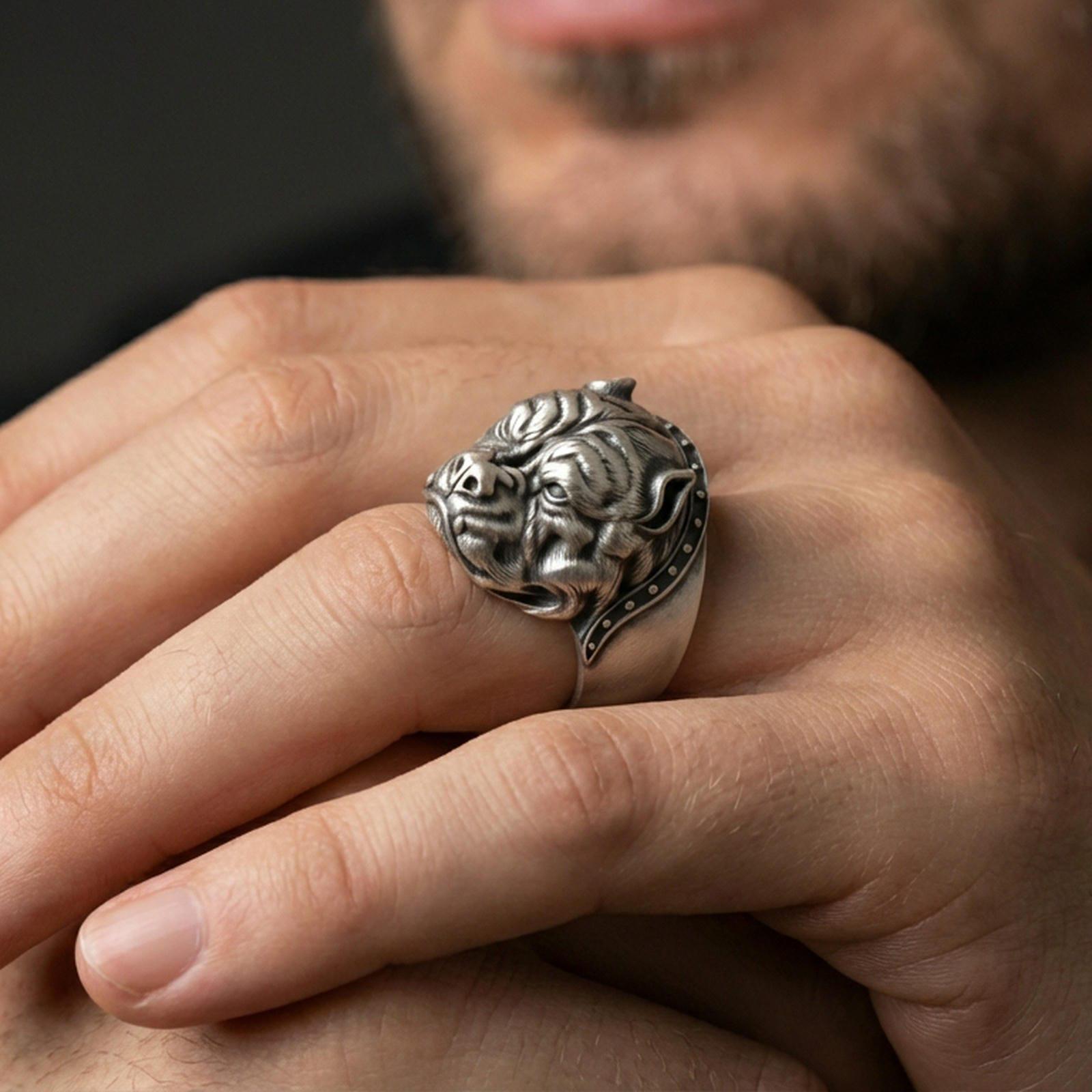Oxidized bulldog head ring worn on finger, lifestyle close-up focusing on the sculpted wrinkles, fierce expression, and collar detail