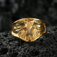 Load image into Gallery viewer, Gold plated elephant signet ring on porous volcanic stone, premium dark studio shot emphasizing the detailed ears, tusks, and bold safari-inspired relief
