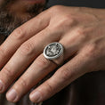 Load image into Gallery viewer, Oxidized wolf signet ring worn on finger, masculine everyday look with rugged animal totem style
