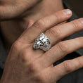 Load image into Gallery viewer, Polished silver lioness head ring on a hand, macro angle emphasizing facial sculpting and clean contours
