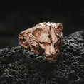 Load image into Gallery viewer, Rose gold plated lioness ring on porous volcanic rock with dramatic contrast and premium studio lighting
