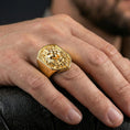 Load image into Gallery viewer, Gold plated lion ring worn on a finger with dark minimal background, emphasizing the roaring lion head relief
