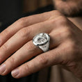 Load image into Gallery viewer, Polished silver ram signet ring on a hand, close-up highlighting the engraved ram head and clean band profile
