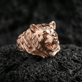 Load image into Gallery viewer, Rose gold plated bear ring on porous volcanic rock with controlled highlights and deep shadow contrast
