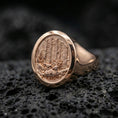 Load image into Gallery viewer, Rose gold plated woodland engraved ring on porous volcanic rock, premium studio lighting and shallow depth
