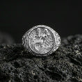 Load image into Gallery viewer, Polished silver mermaid signet ring on black volcanic stone, detailed mermaid relief and wave background, premium studio product photo
