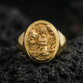 Load image into Gallery viewer, Gold Plated: Gold plated signet ring with bold carved demon/dragon motif on volcanic rock, premium macro product photo
