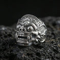 Load image into Gallery viewer, Balinese Barong god sterling silver ring in polished silver finish on volcanic rock, close-up carving detail
