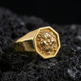 Load image into Gallery viewer, Octagon gold plated Foo Dog signet ring on volcanic rock, bold Chinese guardian lion design, premium macro product image
