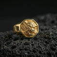 Load image into Gallery viewer, Octagon Foo Dog signet ring in a gold plated finish on volcanic rock, bold Chinese lion face design, premium macro product image
