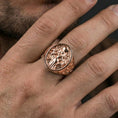 Load image into Gallery viewer, Freya ring in a rose gold plated finish on finger, detailed Freyja engraving, lifestyle wear photo
