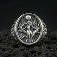 Load image into Gallery viewer, Sterling silver Freya Viking ring in an oxidized finish on volcanic rock, Norse goddess figure engraving, macro studio product shot
