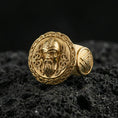 Load image into Gallery viewer, Odin the All-Father ring in a gold plated finish on volcanic rock, Valhalla Viking portrait design with rune-style accents, premium macro product image
