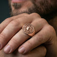 Load image into Gallery viewer, Yggdrasil ring in a rose gold plated finish on finger, detailed Tree of Life knot pattern, lifestyle wear photo
