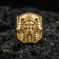 Load image into Gallery viewer, Pharaoh skull ring in a gold plated finish on volcanic rock, ancient Egyptian memento mori statement design, premium macro product image

