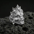 Load image into Gallery viewer, Yama god of death mask ring in polished silver finish on volcanic rock, sculpted fangs and ornate forehead engravings, premium studio close-up

