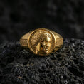 Load image into Gallery viewer, Venus goddess signet ring in a gold plated finish on volcanic rock, antique Roman cameo relief with Greek key detail, luxury macro product photo
