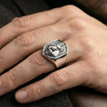 Load image into Gallery viewer, Anubis Egyptian god ring in polished silver finish on finger, geometric signet face and raised relief, clean lifestyle wear photo
