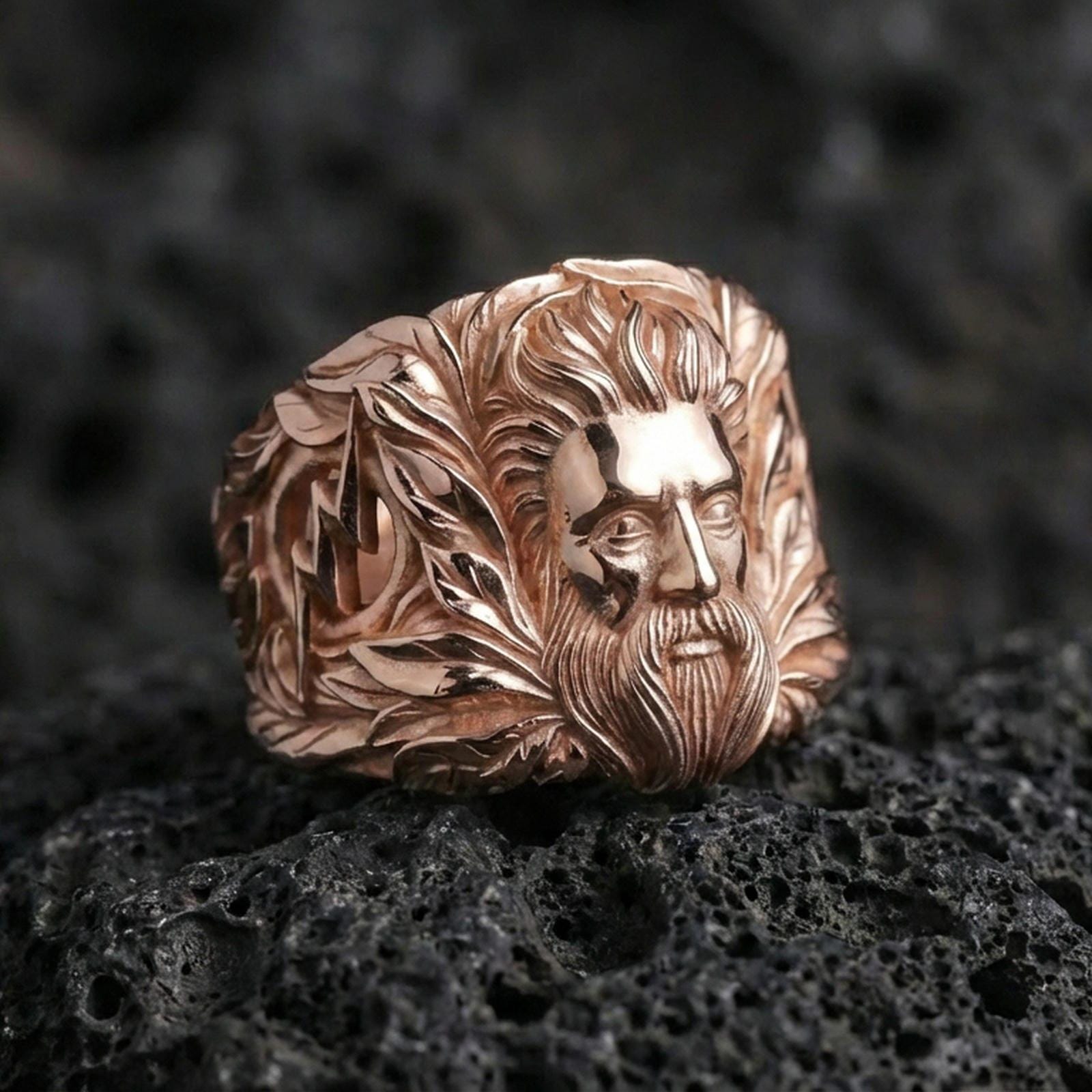 Zeus sky deity ring in rose gold finish on volcanic rock, bold Greek mythology statement ring, premium close-up