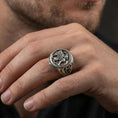 Load image into Gallery viewer, Oxidized sterling silver griffon ring worn on finger, bold mythical creature design with wings and lion body, masculine lifestyle hand shot
