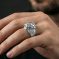 Load image into Gallery viewer, Polished silver Foo Dog ring on finger highlighting detailed lion face and engraved patterns, clean lifestyle wear photo
