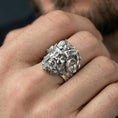 Load image into Gallery viewer, Polished silver Czernobog ring on finger highlighting sculpted horns and dramatic facial features, clean lifestyle wear photo
