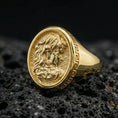 Load image into Gallery viewer, Gold plated Medusa signet ring with high-relief snake hair portrait and ornate Greek key band detail, premium studio macro on black volcanic rock surface
