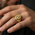 Load image into Gallery viewer, Gold plated Medusa ring worn on finger, statement ancient Greek mythology jewelry with detailed profile relief, premium lifestyle close-up
