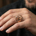 Load image into Gallery viewer, Rose gold plated werewolf head ring on finger featuring snarling wolf face and sharp fang detail, refined fantasy jewelry lifestyle wear shot
