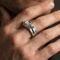 Load image into Gallery viewer, Polished silver twin dragons ring on finger highlighting detailed dragon heads and engraved scales, clean lifestyle wear photo
