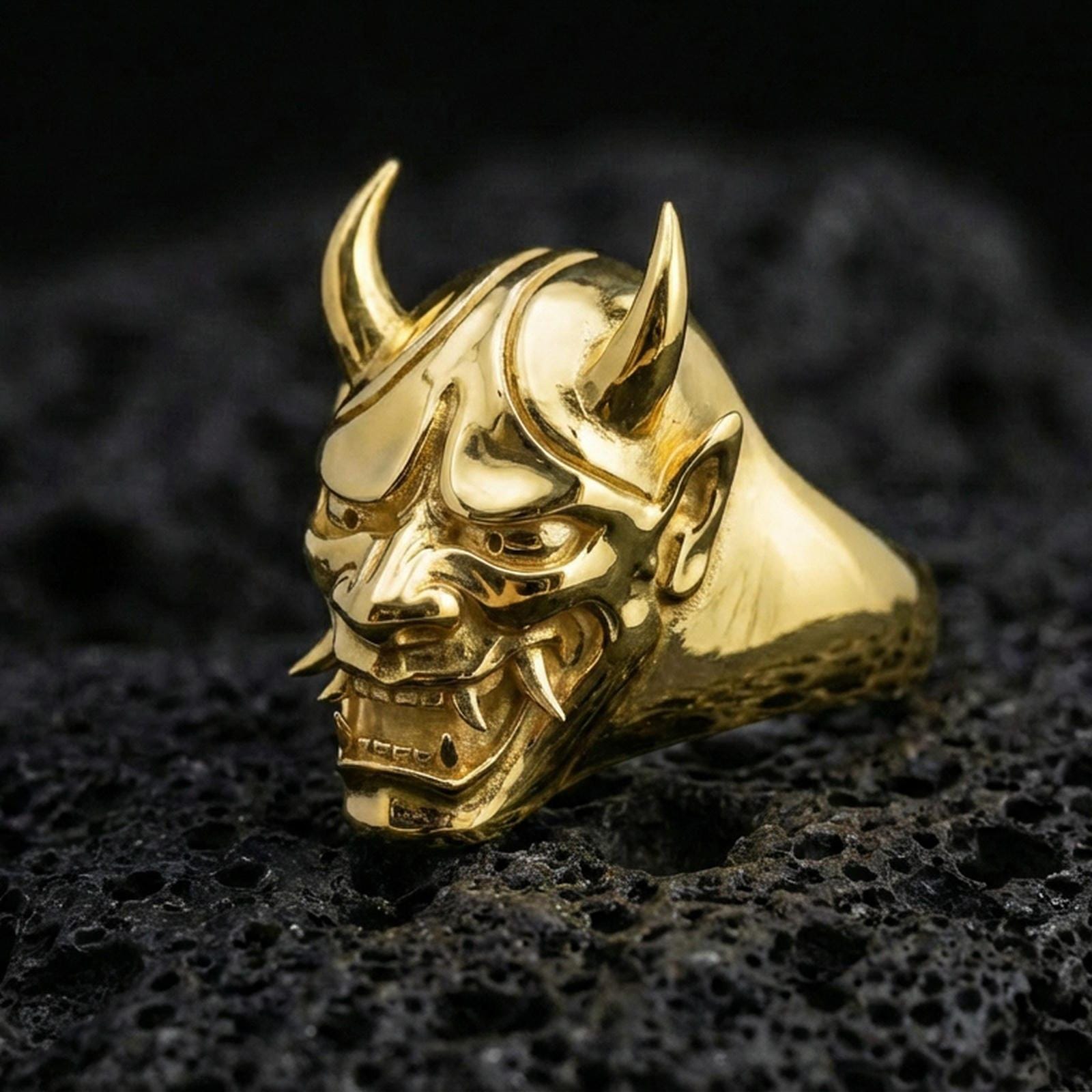 Gold plated Oni mask signet ring on black volcanic stone, Japanese demon mask ring with horns, aggressive fang detail, statement jewelry