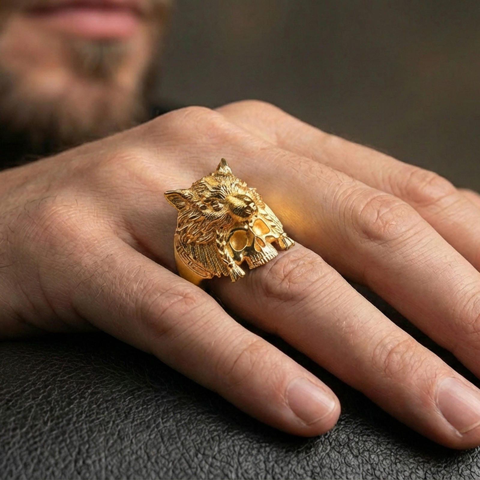 Gold plated wolf headdress skull ring on a human finger, tribal warrior wolf ring, powerful fantasy jewelry look