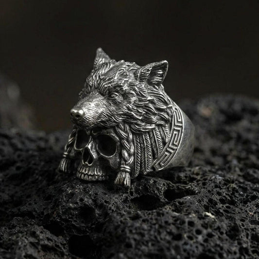 Oxidized sterling silver wolf headdress skull ring on black volcanic stone, tribal warrior wolf head over skull, dark fantasy signet