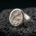 Load image into Gallery viewer, Polished sterling silver Chinese dragon signet ring on black volcanic stone, detailed scaled dragon carving, bold unisex statement ring
