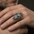 Load image into Gallery viewer, Oxidized sterling silver lich skull ring worn on a human finger, gothic wizard skull design, dark fantasy style
