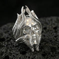 Load image into Gallery viewer, Polished sterling silver lich skull ring on black volcanic stone, intricate skull and tendril design, D&D inspired ring
