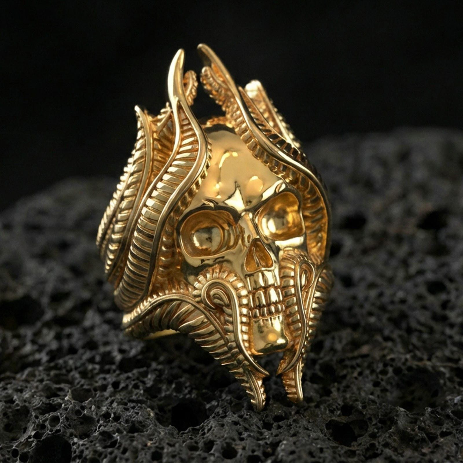 Gold plated lich skull ring on black volcanic stone, dark fantasy wizard skull motif, bold statement jewelry