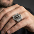Load image into Gallery viewer, Oxidized sterling silver skull signet ring worn on a human finger, brickwork skull design, gothic jewelry
