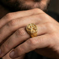 Load image into Gallery viewer, Gold plated wolf and dragon ring worn on a human finger, fantasy jewelry accessory, engraved creature band
