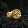 Load image into Gallery viewer, Gold plated wolf and dragon ring on black volcanic stone, fantasy symbolism jewelry, sculpted creature relief
