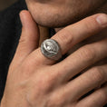 Load image into Gallery viewer, Oxidized sterling silver dragon eye ring worn on a human finger, detailed scale pattern and dragon eye, fantasy ring
