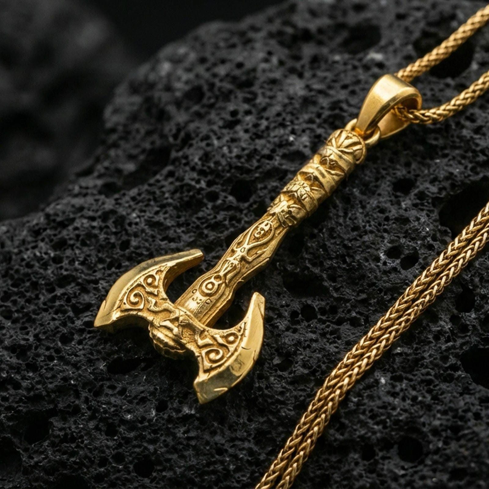 Gold plated Viking labrys axe necklace pendant on black volcanic stone, engraved double-headed axe, braided chain